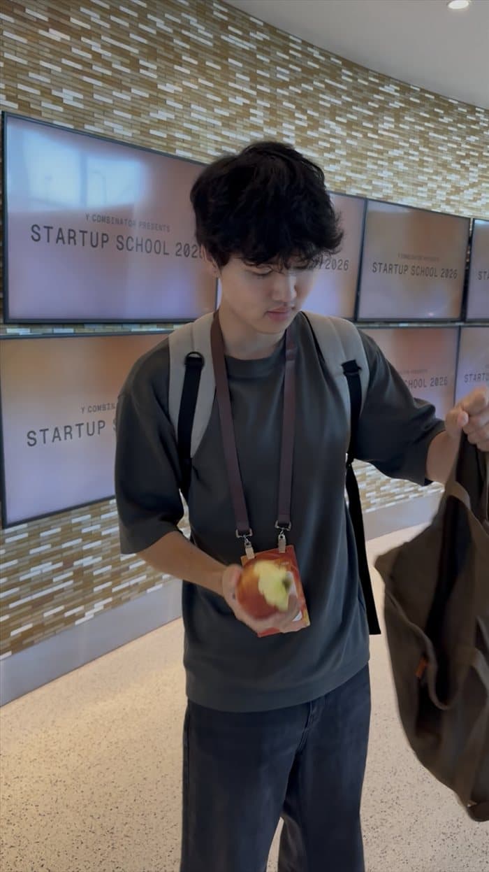 Brandon in front of the Y Combinator Startup School 2026 screens